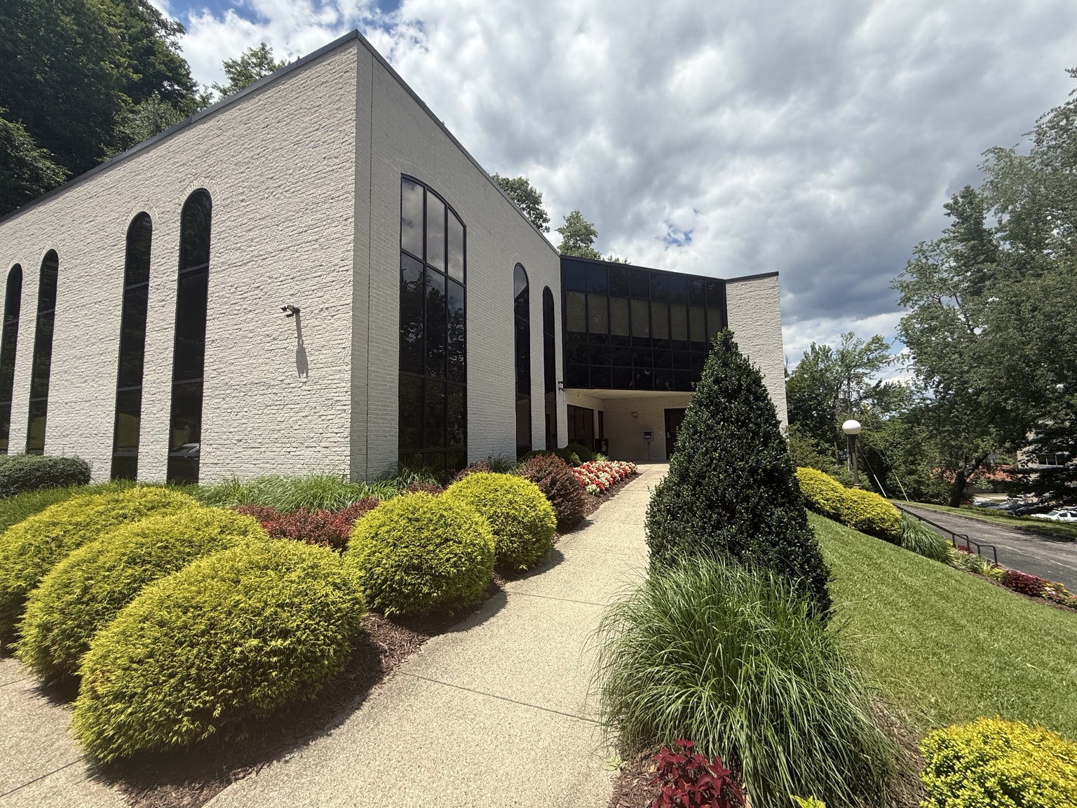 3001 Chesterfield Avenue, with arched windows and landscaped grounds.